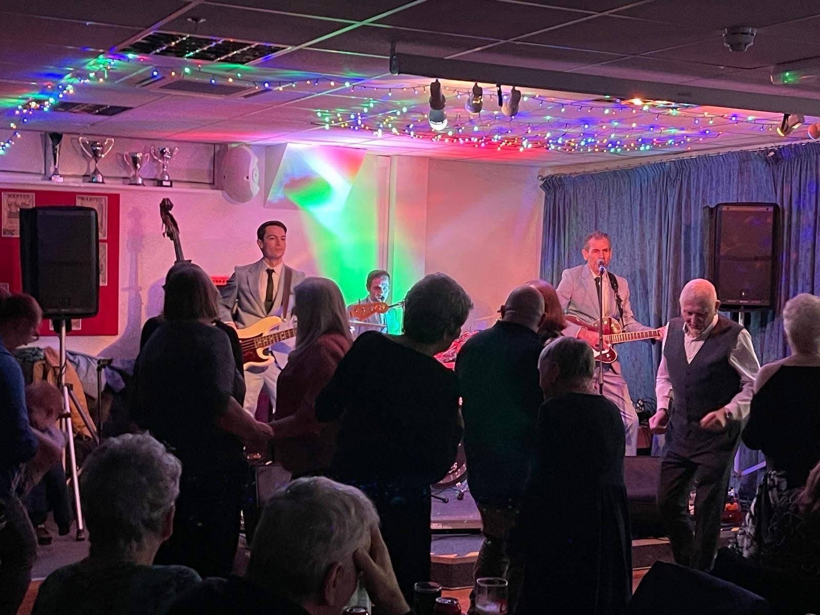 Live on stage with purple lighting