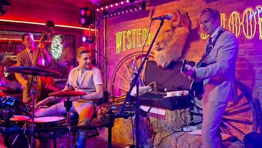At the Western Saloon with a surprise guest in a lion mask