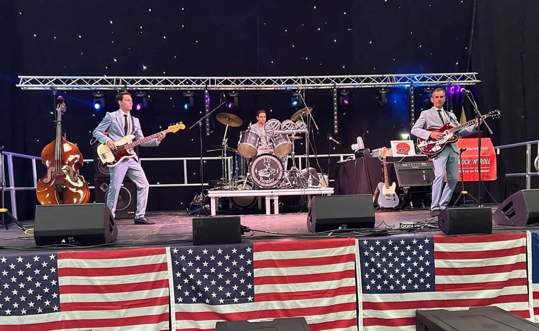 On a big stage with American flags — Rock and Roll night