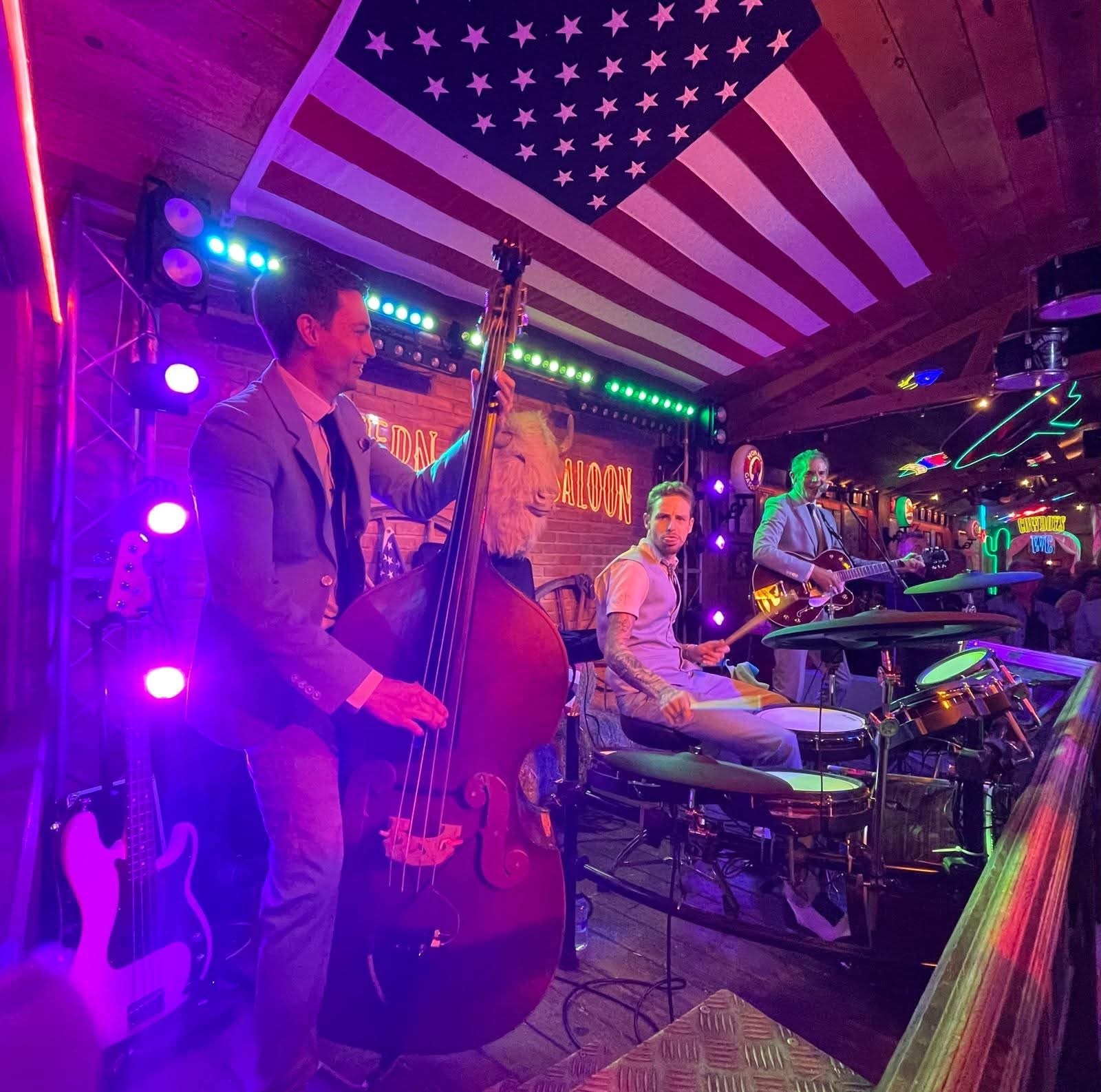 Full band at the Federal Saloon under the American flag