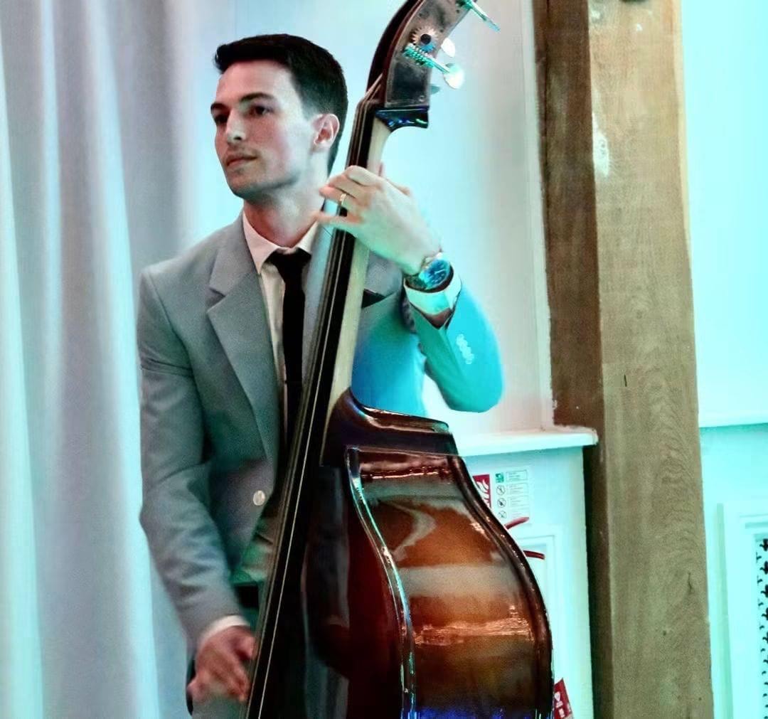 Double bass player — intimate portrait with teal lighting